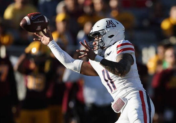 TEMPE, ARIZONA - NOVEMBER 25: Quarterback Noah Fifita #11 of the Arizona Wildcats throws a pass during the second half of the NCAAF game against the Arizona State Sun Devils at Mountain America Stadium on November 25, 2023 in Tempe, Arizona. (Photo by Christian Petersen/Getty Images)