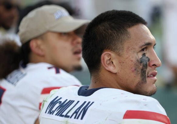 TEMPE, ARIZONA - NOVEMBER 25: Wide receiver Tetairoa McMillan #4 of the Arizona Wildcats sits on the bench during the second half of the NCAAF game against the Arizona State Sun Devils at Mountain America Stadium on November 25, 2023 in Tempe, Arizona. The Wildcats defeated the Sun Devils 59-23. (Photo by Christian Petersen/Getty Images)