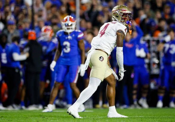 GAINESVILLE, FLORIDA - NOVEMBER 25: Keon Coleman #4 of the Florida State Seminoles looks on during the first half of a game against the Florida Gators at Ben Hill Griffin Stadium on November 25, 2023 in Gainesville, Florida. (Photo by James Gilbert/Getty Images)