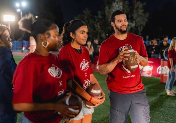 LOS ANGELES, CALIFORNIA: In this image released on November 28, Dr Pepper® and USC star quarterback Caleb Williams hosts Tuition Toss event for rising college students at Challengers Boys and Girls Club in Los Angeles, California. (Photo by Dr Pepper/Getty Images)