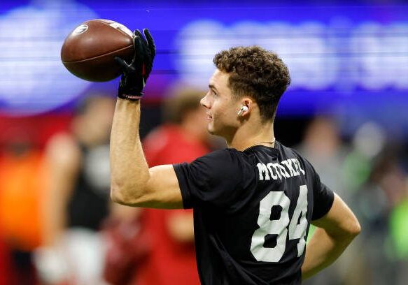 ATLANTA, GEORGIA - DECEMBER 02: Ladd McConkey #84 of the Georgia Bulldogs warms up prior to the SEC Championship game  against the Alabama Crimson Tide at Mercedes-Benz Stadium on December 02, 2023 in Atlanta, Georgia. (Photo by Todd Kirkland/Getty Images)