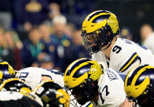 INDIANAPOLIS, INDIANA - DECEMBER 02: J.J. McCarthy #9 of the Michigan Wolverines directs his team xgaii during the Big Ten Championship at Lucas Oil Stadium on December 02, 2023 in Indianapolis, Indiana. (Photo by Justin Casterline/Getty Images)
