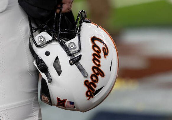 HOUSTON, TX - DECEMBER 27: Oklahoma State Cowboys helmet is held after the TaxAct Texas Bowl between Texas A&amp;M Aggies and Oklahoma State Cowboys on December 27, 2023, at NRG Stadium in Houston, Texas.  (Photo by David Buono/Icon Sportswire via Getty Images)