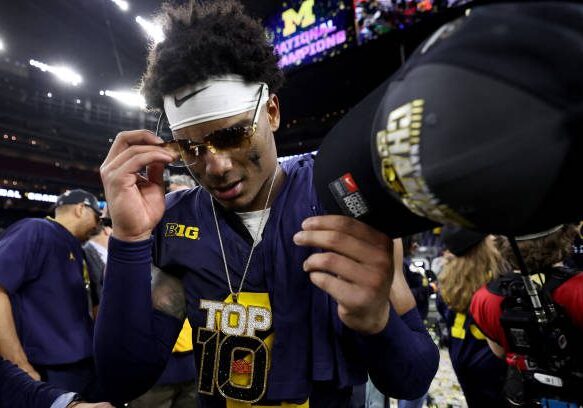 HOUSTON, TEXAS - JANUARY 08: Will Johnson #2 of the Michigan Wolverines celebrates after defeating the Washington Huskies during the 2024 CFP National Championship game at NRG Stadium on January 08, 2024 in Houston, Texas. Michigan defeated Washington 34-13. (Photo by Gregory Shamus/Getty Images)