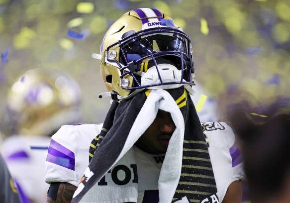 HOUSTON, TEXAS - JANUARY 08: Michael Penix Jr. #9 of the Washington Huskies leaves the field following the 2024 CFP National Championship game against the Michigan Wolverines at NRG Stadium on January 08, 2024 in Houston, Texas.  Michigan defeated Washington 34-13. (Photo by Stacy Revere/Getty Images)