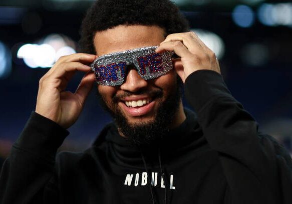 INDIANAPOLIS, INDIANA - MARCH 2: Caleb Williams #QB14 of Southern California smiles while wearing “Draft Me” sunglasses during the NFL Combine at the Indiana Convention Center on March 2, 2024 in Indianapolis, Indiana. (Photo by Kevin Sabitus/Getty Images)