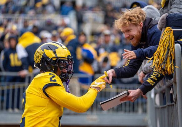 ANN ARBOR, MICHIGAN - APRIL 20: Will Johnson #2 of the Maize Team interacts with fans prior to the Michigan Football Spring Game at Michigan Stadium on April 20, 2024 in Ann Arbor, Michigan. (Photo by Jaime Crawford/Getty Images)
