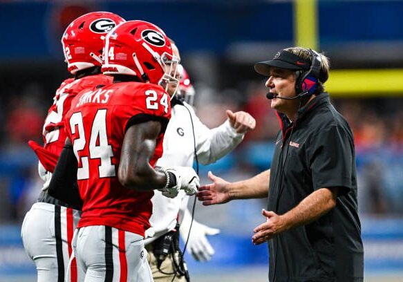 ATLANTA, GA  AUGUST 31:  Georgia head coach Kirby Smart congratulates defensive back Malaki Starks (24) during the Aflac Kickoff Game between the Clemson Tigers and the Georgia Bulldogs on August 31st, 2024 at Mercedes-Benz Stadium in Atlanta, GA.  (Photo by Rich von Biberstein/Icon Sportswire via Getty Images)