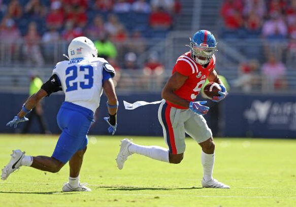 OXFORD, MISSISSIPPI - SEPTEMBER 07: Tre Harris #9 of the Mississippi Rebels carries the ball against Jalen Jackson #23 of the Middle Tennessee Blue Raiders during the game at Vaught-Hemingway Stadium on September 07, 2024 in Oxford, Mississippi. (Photo by Justin Ford/Getty Images)