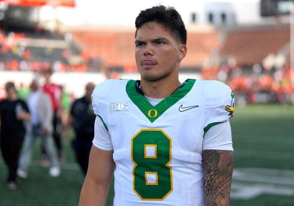 CORVALLIS, OREGON - SEPTEMBER 14: Dillon Gabriel #8 of the Oregon Ducks leaves the field after the game against the Oregon State Beavers at Reser Stadium on September 14, 2024 in Corvallis, Oregon.  (Photo by Soobum Im/Getty Images)