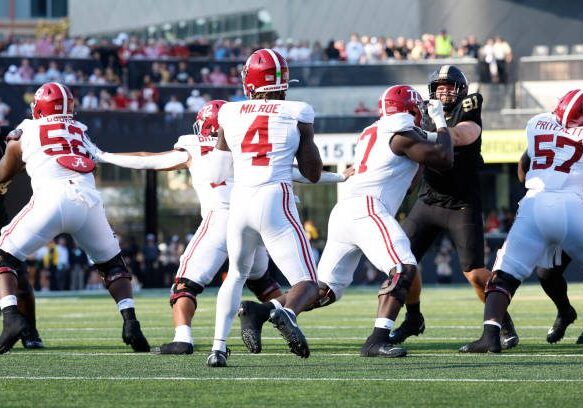 NASHVILLE, TN - OCTOBER 05: Alabama Crimson Tide quarterback Jalen Milroe (4) sits in the pocket as offensive lineman Tyler Booker (52), offensive lineman Parker Brailsford (72), offensive lineman Jaeden Roberts (77), and offensive lineman Elijah Pritchett (57) block during a game between the Vanderbilt Commodores and Alabama Crimson Tide, October 5, 2024 at FirstBank Stadium in Nashville, Tennessee. (Photo by Matthew Maxey/Icon Sportswire via Getty Images)