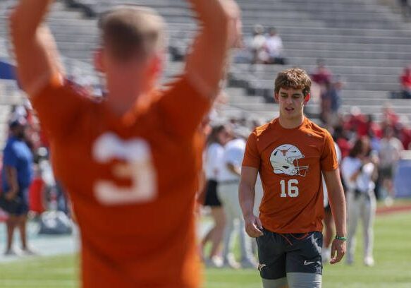 gettyimages-2177646982-612x612 DALLAS, TX - OCTOBER 12: Texas Longhorns quarterback Arch Manning (16) on the field for warmups as Texas Longhorns quarterback Quinn Ewers (3) stretches in the foreground before the Allstate Red River Rivalry SEC college football game between Texas Longhorns and Oklahoma Sooners on October 12, 2024, at Cotton Bowl Stadium in Dallas, TX. (Photo by David Buono/Icon Sportswire via Getty Images)