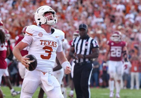 DALLAS, TEXAS - OCTOBER 12: Quinn Ewers #3 of the Texas Longhorns celebrates after scoring a touchdown during the fourth quarter against the Oklahoma Sooners at Cotton Bowl Stadium on October 12, 2024 in Dallas, Texas. (Photo by Sam Hodde/Getty Images)