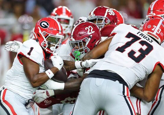 gettyimages-2178776088-612x612 TUSCALOOSA, ALABAMA - SEPTEMBER 28: Trevor Etienne #1 of the Georgia Bulldogs rushes behind Xavier Truss #73 against LT Overton #22 of the Alabama Crimson Tide during the first quarter at Bryant-Denny Stadium on September 28, 2024 in Tuscaloosa, Alabama. (Photo by Kevin C. Cox/Getty Images)