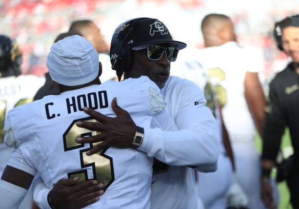TUCSON, AZ - OCTOBER 19: Colorado Buffaloes head coach Deion Sanders congratulates Colorado Buffaloes cornerback Colton Hood #3 after he intercepted a pass during a football game between the University of Colorado Buffaloes and the University of Arizona Wildcats.  October 19, 2024 at Arizona Stadium in Tucson, AZ. (Photo by Christopher Hook/Icon Sportswire via Getty Images)