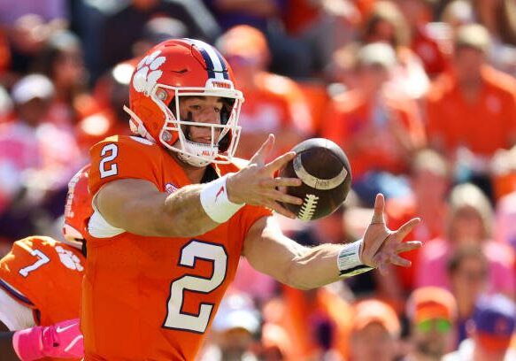 gettyimages-2180028341-612x612 CLEMSON, SOUTH CAROLINA - OCTOBER 19: Cade Klubnik #2 of the Clemson Tigers takes a high snap during the second quarter against the Virginia Cavaliers at Memorial Stadium on October 19, 2024 in Clemson, South Carolina. (Photo by Isaiah Vazquez/Getty Images)
