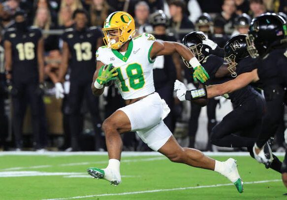 WEST LAFAYETTE, INDIANA - OCTOBER 18: Kenyon Sadiq #18 of the Oregon Ducks  runs the ball against the Purdue Boilermakers at Ross-Ade Stadium on October 18, 2024 in West Lafayette, Indiana. (Photo by Justin Casterline/Getty Images)