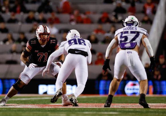 gettyimages-2180837815-612x612 SALT LAKE CITY, UT - OCTOBER 19: Caleb Lomu #71 of the Utah Utes blocks Travis Jackson #96 of the TCU Horned Frogs in the first half at Rice Eccles Stadium on October 19, 2024 in Salt Lake City, Utah. (Photo by Aaron M. Sprecher/Getty Images