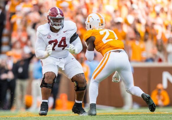 KNOXVILLE, TN - OCTOBER 19: Alabama Crimson Tide offensive lineman Kadyn Proctor (74) blocks Tennessee Volunteers defensive lineman James Pearce Jr. (27) during the college football game between the Tennessee Volunteers and the Alabama Crimson Tide on October 19, 2024, at Neyland Stadium in Knoxville, TN. (Photo by Bryan Lynn/Icon Sportswire via Getty Images)