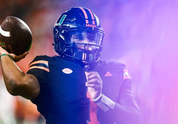 MIAMI GARDENS, FLORIDA - OCTOBER 26: Cam Ward #1 of the Miami Hurricanes warms up on the sideline against the Florida State Seminoles during the first half at Hard Rock Stadium on October 26, 2024 in Miami Gardens, Florida.  (Photo by Carmen Mandato/Getty Images)