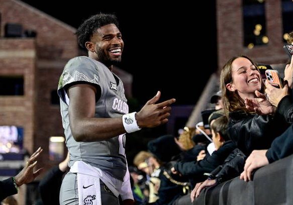 BOULDER, CO - OCTOBER 26:  Shedeur Sanders #2 of the Colorado Buffaloes greets supporters after a win against the Cincinnati Bearcats at Folsom Field on October 26, 2024 in Boulder, Colorado. (Photo by Dustin Bradford/Getty Images)