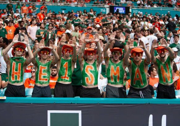 MIAMI GARDENS, FLORIDA - NOVEMBER 02: Miami Hurricanes fans are pictured with HEISMAN in the stands during the game between Miami Hurricanes and Duke at Hard Rock Stadium on November 2, 2024 in Miami Gardens, Florida. (Photo by Michael Pimentel/ISI Photos/Getty Images)