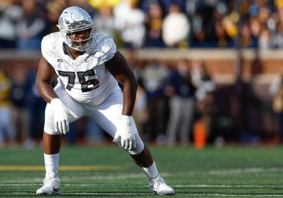 ANN ARBOR, MICHIGAN - NOVEMBER 2: Josh Conerly Jr. #76 of the Oregon Ducks lines up on the line of scrimmage during the first half of a game against the Michigan Wolverines at Michigan Stadium on November 2, 2024 in Ann Arbor, Michigan. (Photo by Brandon Sloter/Image Of Sport/Getty Images)