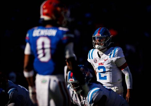 GAINESVILLE, FLORIDA - NOVEMBER 23: Jaxson Dart #2 of the Mississippi Rebels reacts during the second half of a game against the Florida Gators at Ben Hill Griffin Stadium on November 23, 2024 in Gainesville, Florida. (Photo by James Gilbert/Getty Images)