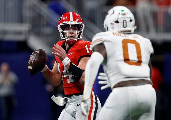 gettyimages-2188782804-612x612 ATLANTA, GEORGIA - DECEMBER 07: Gunner Stockton #14 of the Georgia Bulldogs throws a pass under pressure against Anthony Hill Jr. #0 of the Texas Longhorns during the third quarter of the 2024 SEC Championship at Mercedes-Benz Stadium on December 07, 2024 in Atlanta, Georgia. (Photo by Butch Dill/Getty Images)