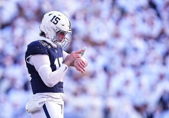 gettyimages-2190963404-612x612 STATE COLLEGE, PENNSYLVANIA - DECEMBER 21: Drew Allar #15 of the Penn State Nittany Lions looks at his play sheet during the first quarter against the Southern Methodist Mustangs in the Playoff First Round Game at Beaver Stadium on December 21, 2024 in State College, Pennsylvania. (Photo by Mitchell Leff/Getty Images)