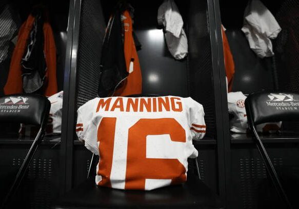 gettyimages-2191711261-612x612 ATLANTA, GEORGIA - JANUARY 1: A general view of the pads and jersey for Arch Manning #16 of the Texas Longhorns in the locker room prior to the game against the Arizona State Sun Devils at Mercedes-Benz Stadium on January 1, 2025 in Atlanta, Georgia. (Photo by CFP/Getty Images)