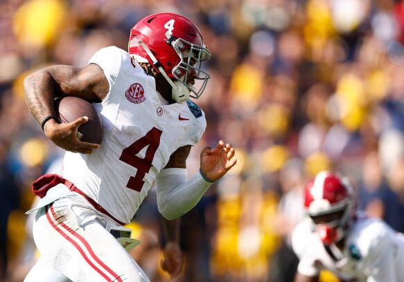 TAMPA, FLORIDA - DECEMBER 31: Jalen Milroe #4 of the Alabama Crimson Tide runs with the ball against the Michigan Wolverines during the second quarter in the 2024 ReliaQuest Bowl at Raymond James Stadium on December 31, 2024 in Tampa, Florida.  (Photo by Douglas P. DeFelice/Getty Images)