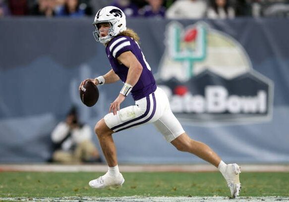 gettyimages-2192584120-612x612 PHOENIX, ARIZONA - DECEMBER 26: Quarterback Avery Johnson #2 of the Kansas State Wildcats scrambles during the Rate Bowl against the Rutgers Scarlet Knights at Chase Field on December 26, 2024 in Phoenix, Arizona. The Wildcats defeated the Scarlet Knights 44-41. (Photo by Chris Coduto/Getty Images)
