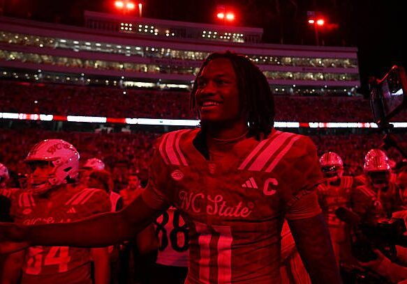 RALEIGH, NC - AUGUST 28: Quarterback CJ Bailey #11 of the NC State Wolfpack celebrates with teammates after the College Football game between the NC State Wolfpack and the East Carolina Pirates on August 28, 2025 at Carter-Finley Stadium in Raleigh, North Carolina. (Photo by Katherine Gawlik/Icon Sportswire via Getty Images)