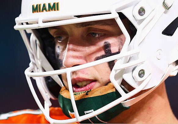 MIAMI GARDENS, FLORIDA - OCTOBER 17: Carson Beck #11 of the Miami Hurricanes looks on during the first half of the game against the Louisville Cardinals at Hard Rock Stadium on October 17, 2025 in Miami Gardens, Florida. (Photo by Megan Briggs/Getty Images)