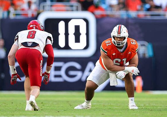 MIAMI GARDENS, FLORIDA - NOVEMBER 15: Francis Mauigoa #61 of the Miami Hurricanes plays against the NC State Wolfpack during the second quarter of the game at Hard Rock Stadium on November 15, 2025 in Miami Gardens, Florida. (Photo by Megan Briggs/Getty Images)