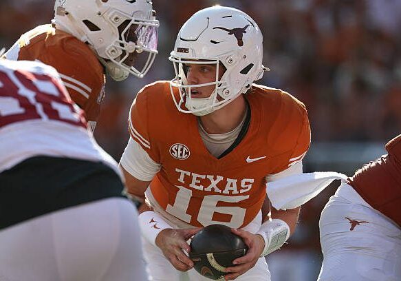 AUSTIN, TX - NOVEMBER 22: Quarterback Arch Manning #16 of the Texas Longhorns turns with the ball after a snap during the SEC football game between Texas Longhorns and Arkansas Razorbacks on November 22, 2025, at Darrell K Royal-Texas Memorial Stadium in Austin, TX. (Photo by David Buono/Icon Sportswire via Getty Images)