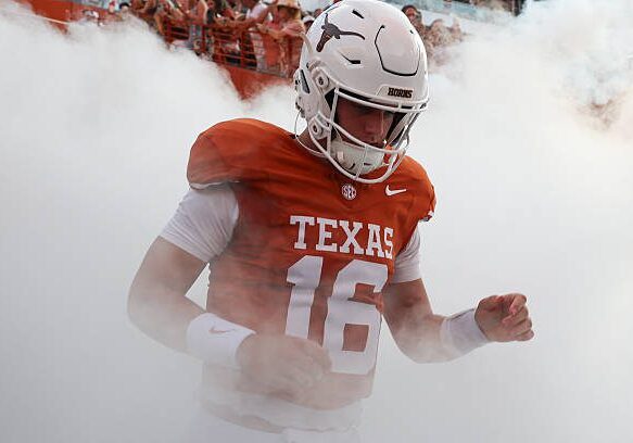 AUSTIN, TX - SEPTEMBER 12: Quarterback Arch Manning #16 of the Texas Longhorns runs onto the field surrounded by smoke before the start of the college football game the Texas Longhorns and the Ohio State Buckeyes on September 12, 2026, at Darrell K Royal-Texas Memorial Stadium in Austin, TX. (Photo by David Buono/Icon Sportswire via Getty Images)