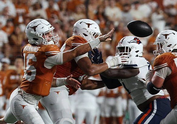 AUSTIN, TX - SEPTEMBER 19: Quarterback Arch Manning #16 of the Texas Longhorns winces as he makes a shovel pass during the college football game between the Texas Longhorns and UTSA Roadrunners on September 19, 2026, at Darrell K Royal-Texas Memorial Stadium in Austin, TX. (Photo by David Buono/Icon Sportswire via Getty Images)