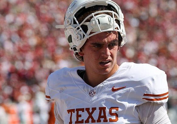 DALLAS, TX - OCTOBER 10: Texas Longhorns quarterback Arch Manning #16 balances his helmet on his head before the Allstate Red River Rivalry between the Texas Longhorns and Oklahoma Sooners on October 10, 2026, at Cotton Bowl Stadium in Dallas, TX. (Photo by David Buono/Icon Sportswire via Getty Images)