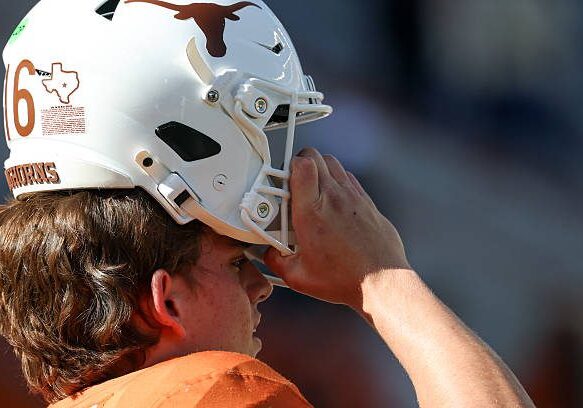 AUSTIN, TX - OCTOBER 17: Texas Longhorns quarterback Arch Manning #16 readies to pull his helmet onto his head ahead of the SEC football game between the Texas Longhorns and Florida Gators on October 17, 2026, at Darrell K Royal-Texas Memorial Stadium in Austin, TX. (Photo by David Buono/Icon Sportswire via Getty Images)