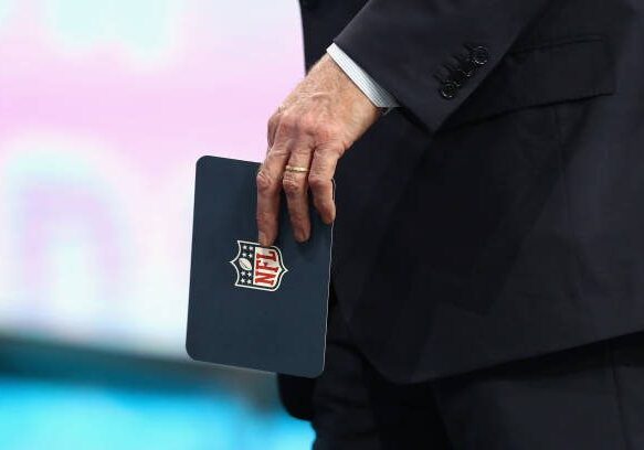 ARLINGTON, TX - APRIL 26:  NFL Commissioner Roger Goodell holds a cue card during the first round of the 2018 NFL Draft at AT&amp;T Stadium on April 26, 2018 in Arlington, Texas.  (Photo by Ronald Martinez/Getty Images)
