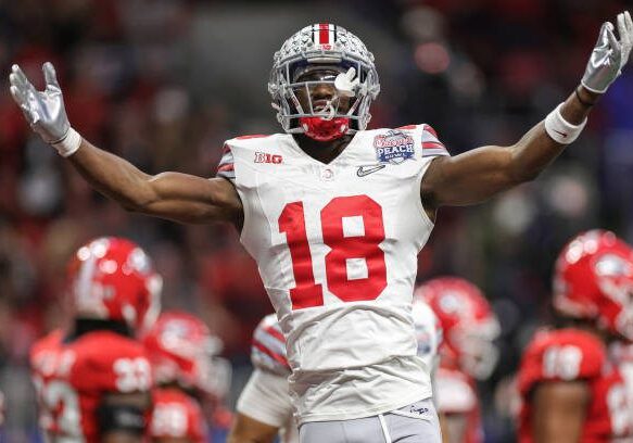 ATLANTA, GEORGIA - DECEMBER 31: Marvin Harrison Jr. #18 of the Ohio State Buckeyes celebrates after a touchdown during the second quarter in the Chick-fil-A Peach Bowl at Mercedes-Benz Stadium on December 31, 2022 in Atlanta, Georgia. (Photo by Carmen Mandato/Getty Images)