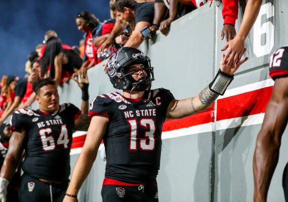 RALEIGH, NC - SEPTEMBER 17: Devin Leary (13) of the North Carolina State Wolfpack celebrates with fans after a football game between the North Carolina State Wolfpack and the Texas Tech Red Raiders on Sep 17, 2022, at Carter-Finley Stadium in Raleigh, NC. (Photo by David Jensen/Icon Sportswire via Getty Images)