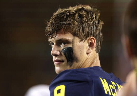 ANN ARBOR, MICHIGAN - SEPTEMBER 10: J.J. McCarthy #9 of the Michigan Wolverines looks on from the sidelines while playing the Hawaii Warriors at Michigan Stadium on September 10, 2022 in Ann Arbor, Michigan. (Photo by Gregory Shamus/Getty Images)