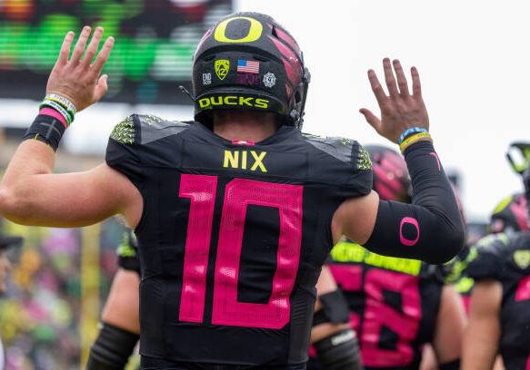 EUGENE, OR - OCTOBER 22: Quarterback Bo Nix #10 of the Oregon Ducks runs to pass the ball against the UCLA Bruins during the first half at Autzen Stadium on October 22, 2022 in Eugene, Oregon. (Photo by Tom Hauck/Getty Images)