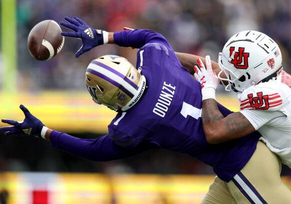 SEATTLE, WASHINGTON - NOVEMBER 11: Rome Odunze #1 of the Washington Huskies can't pull in a catch against JaTravis Broughton #4 of the Utah Utes during the second quarter at Husky Stadium on November 11, 2023 in Seattle, Washington. (Photo by Steph Chambers/Getty Images)