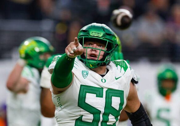 LAS VEGAS, NEVADA - DECEMBER 1: Jackson Powers-Johnson #58 of the Oregon Ducks reacts during the Pac-12 Championship game against the Washington Huskies at Allegiant Stadium on December 1, 2023 in Las Vegas, Nevada. (Photo by Brandon Sloter/Image Of Sport/Getty Images)