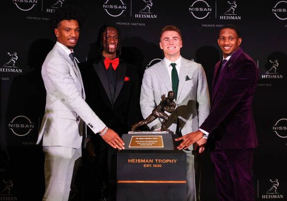 NEW YORK, NY - DECEMBER 09:  Jayden Daniels quarterback LSU, Marvin Harrison Jr. wide receiver from Ohio State,  Bo Nix quarterback, Oregon, Michael Penix Jr, quarterback, Washington pose with the Trophy during the Heisman Trophy press conference at the New York Marriott Marquis on December 9, 2023 in New York City, New York.  (Photo by Rich Graessle/Icon Sportswire via Getty Images)