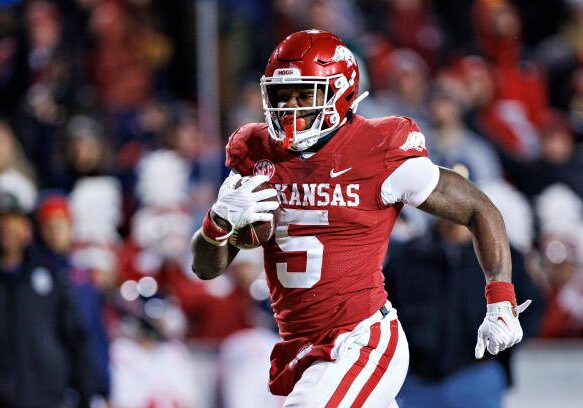 FAYETTEVILLE, ARKANSAS - NOVEMBER 19: Raheim Sanders #5 of the Arkansas Razorbacks runs the ball during a game against the Mississippi Rebels at Donald W. Reynolds Razorback Stadium on November 19, 2022 in Fayetteville, Arkansas. The Razorbacks defeated the Rebels 42-27.  (Photo by Wesley Hitt/Getty Images)